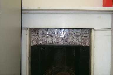 Fireplace with tiles above